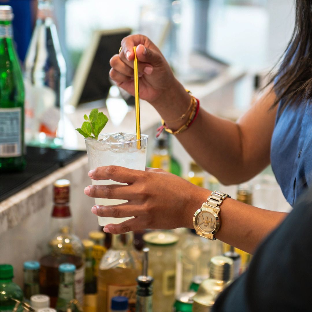 Professional bartender preparing craft cocktails for a private luxury reception at Museo.