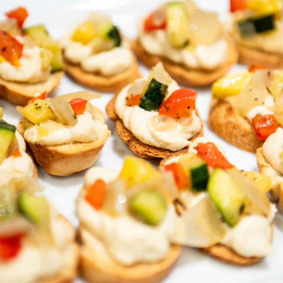 Exquisite bite-sized canapés and hors d'oeuvres served during an upscale event.
