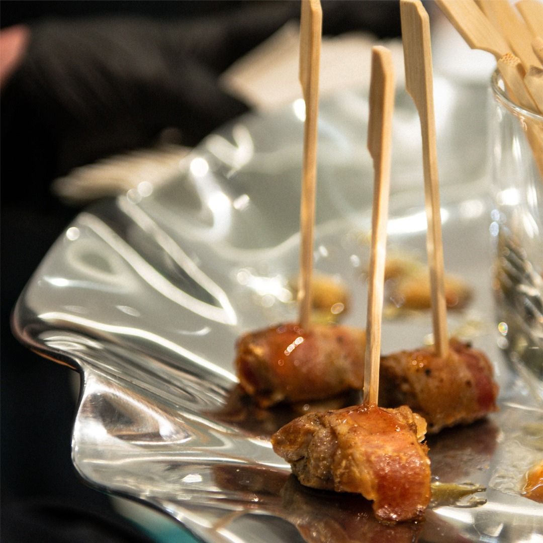 Close-up of gourmet skewered appetizers served during a luxury reception at Museo.