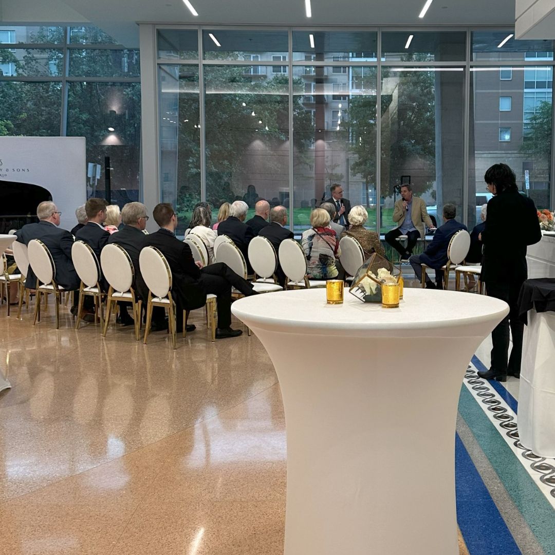 Wide view of the pristine marble lobby set up with elegant seating and cocktail tables for a corporate presentation at Museo.