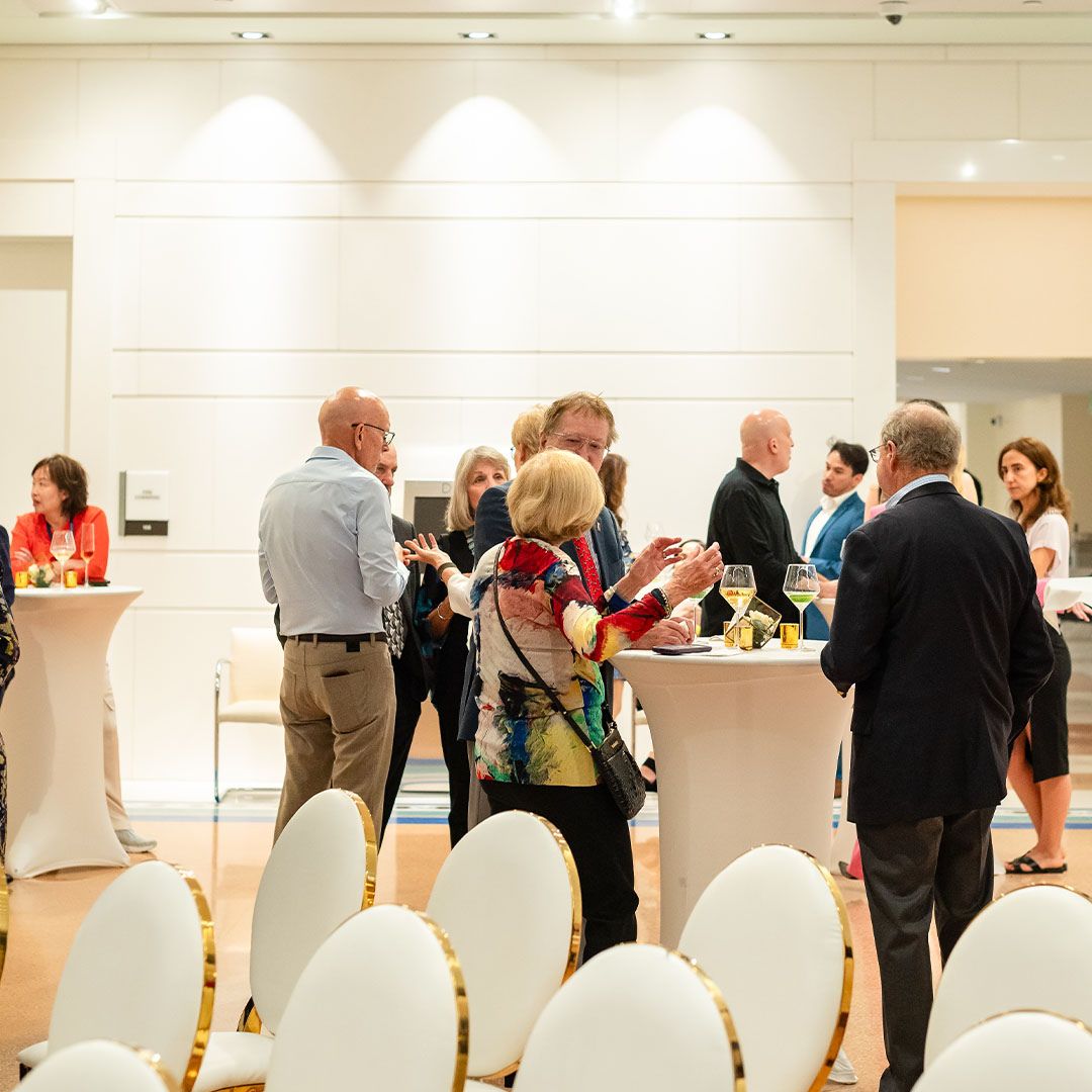Guests socializing and networking during a private cocktail reception at Museo Houston.