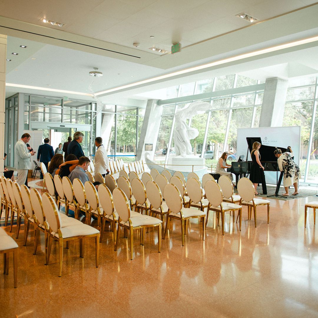 Formal seating arrangement with gold chairs prepared for an upcoming private gathering at Museo.