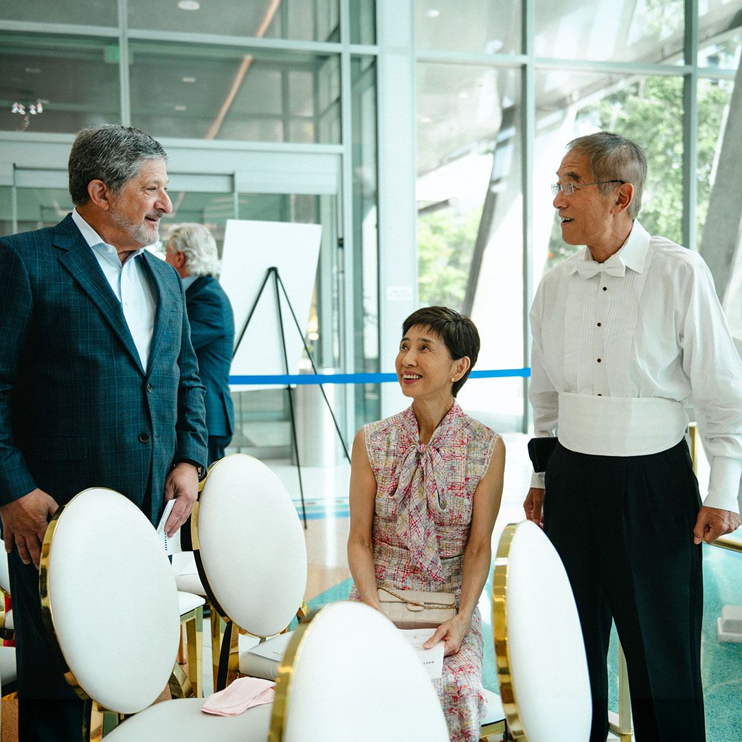 Representatives and guests interacting during an institutional milestone event at Museo Houston.