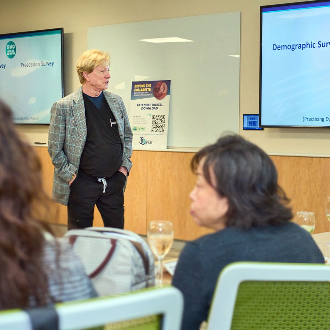 An expert speaker engaging with a seated audience during a specialized medical seminar at Museo.