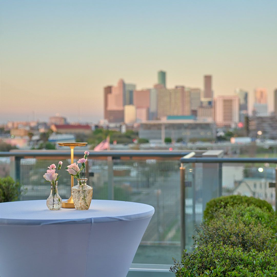 The Houston city skyline serves as a stunning backdrop for a cocktail reception on the Museo terrace.