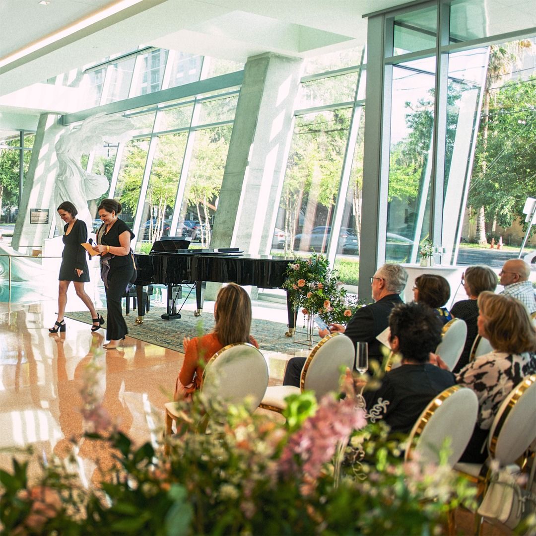 Sunlight streaming through the glass facade during a private musical reception at Museo.
